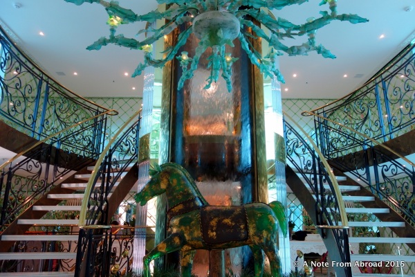 A specially commissioned full size horse statue and hand-blown Murano chandelier welcome us on board the SS Catherine